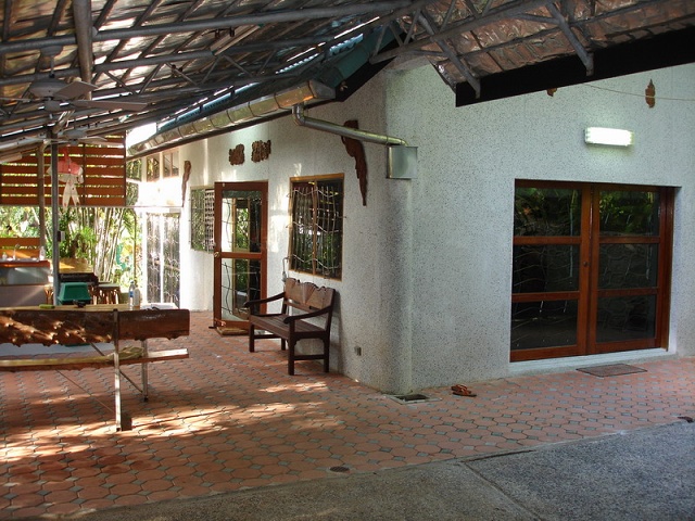 Overview Of House From Covered Area (carport)